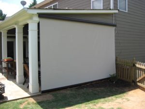 Cable-guided motorized retractable screens