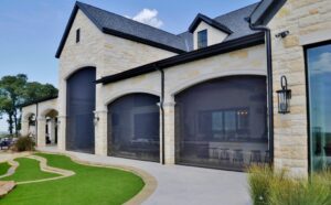 Motorized retractable screens for patios, porches, and large openings.