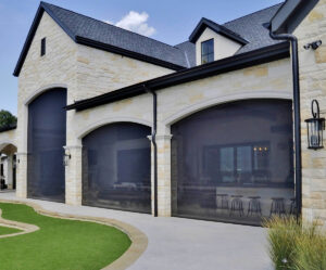 Motorized retractable screens for patios, porches, and large openings.